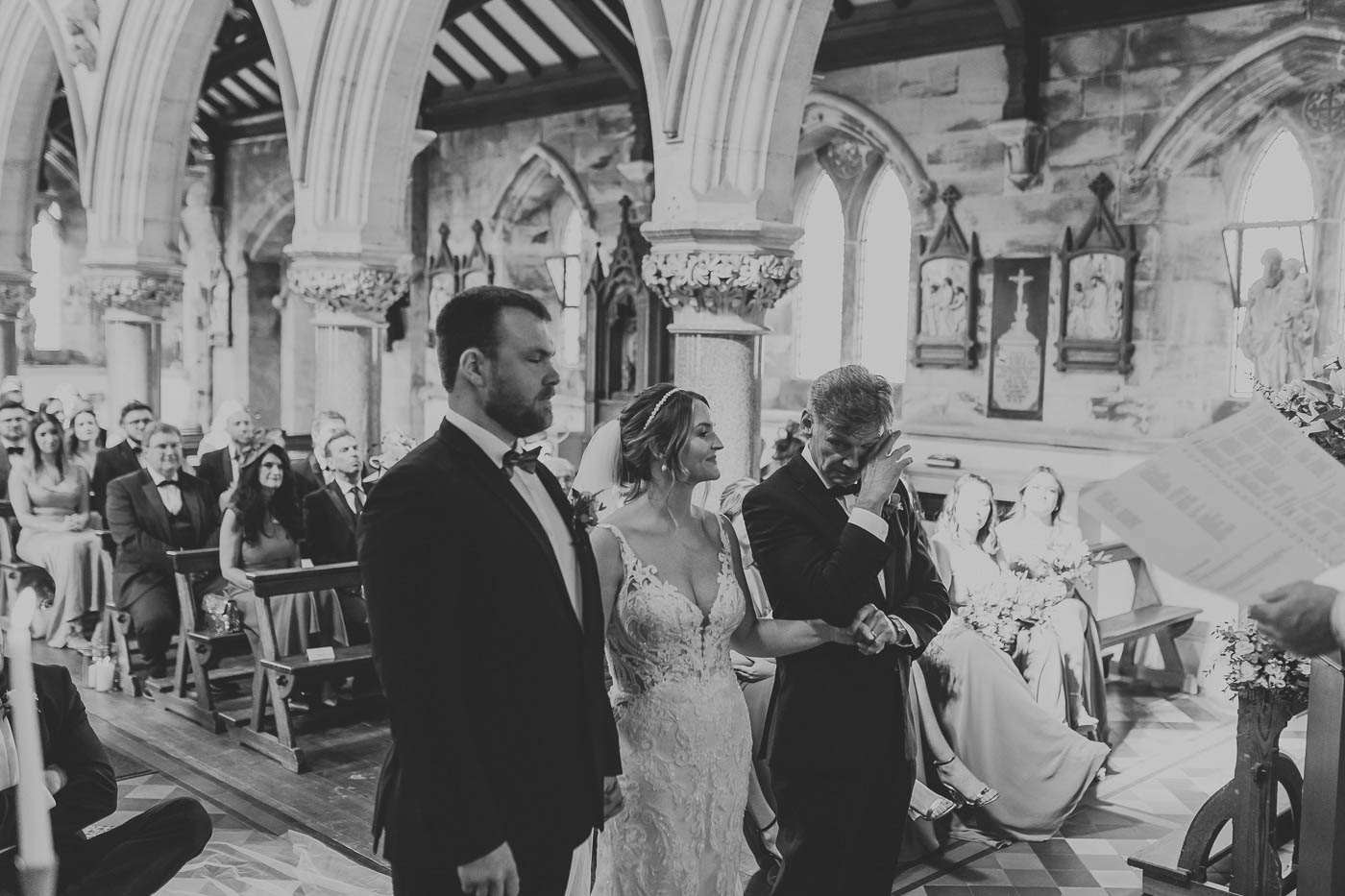 rudding park wedding | photo of father of the bride wiping away tears during wedding ceremony at rudding park chapel | harrogate wedding photographer