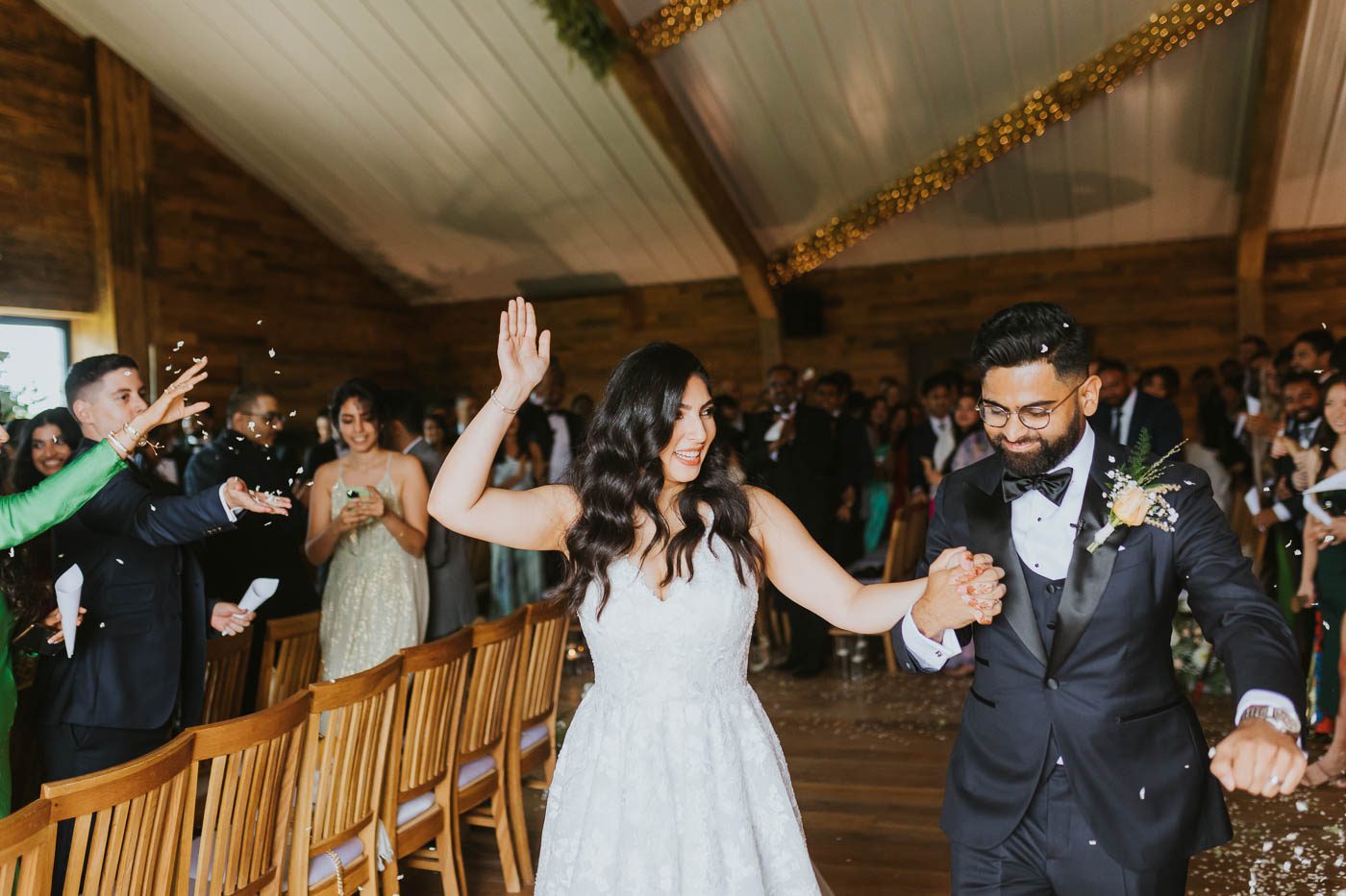 woodstock wedding and events photography | bride and groom dance up the aisle after their wedding ceremony