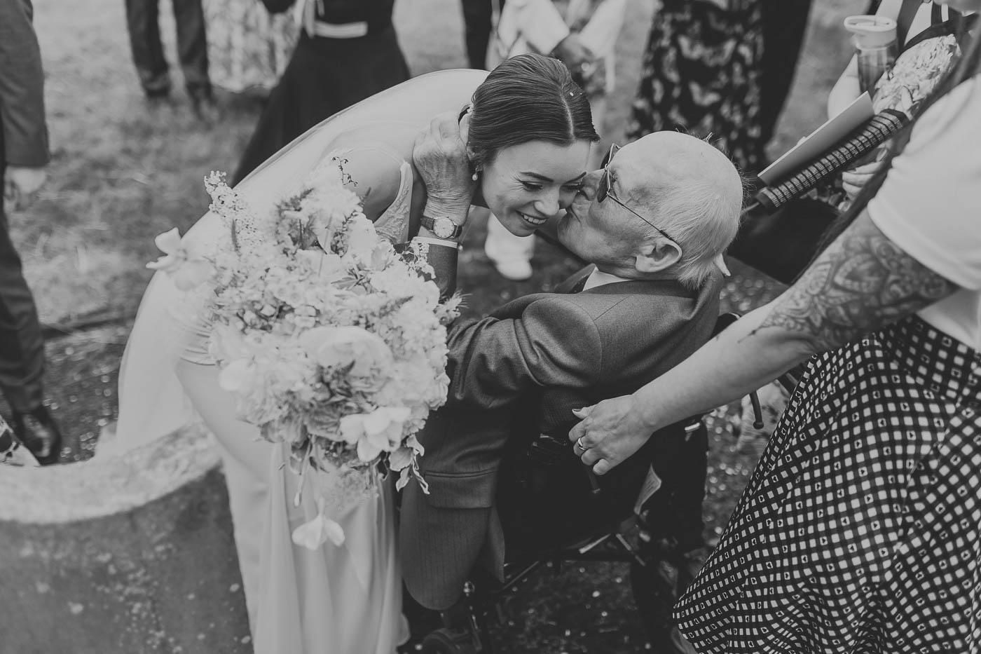 falcon manor wedding photographer yorkshire | natural photo of bride with her grandfather after her church wedding ceremony in gargrave | documentary wedding photography yorkshire