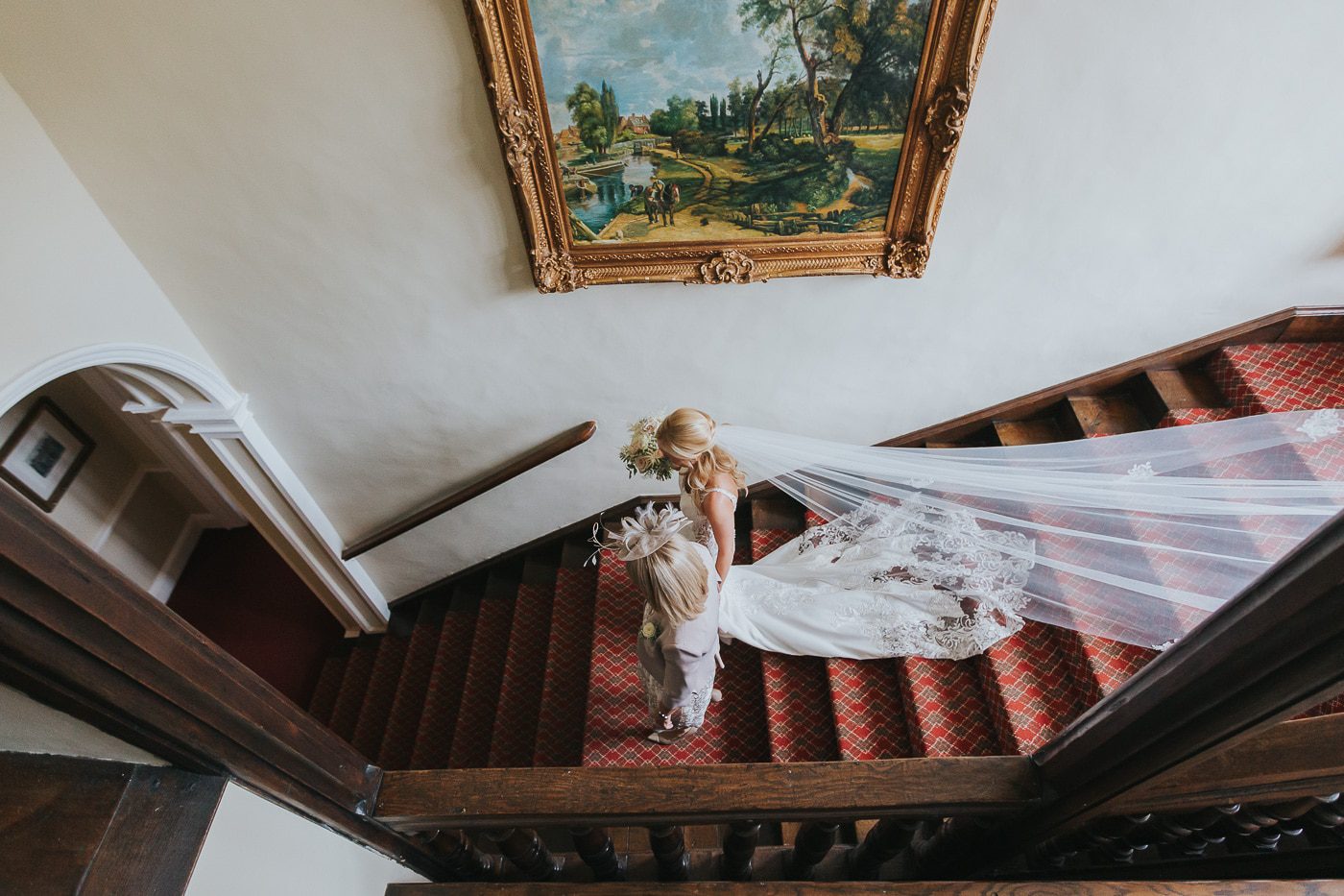 yorkshire wedding photos. bride walking down stairs at goldsborough hall